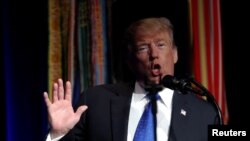 U.S. President Donald Trump is seen through his transparent teleprompter as he speaks during the Missile Defense Review announcement at the Pentagon in Arlington, Virginia, U.S., January 17, 2019. 