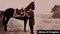Ulysses S. Grant standing with his war horse, "Cincinnati"