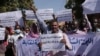 Sudanese journalists protest in Khartoum, Sudan, on November 16, 2021. The placard in the middle reads: "Free press will remain, tyrants are fleeting."