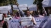 Sudanese journalist protest in Khartoum, Sudan, Nov.16, 2021. The placard in the middle reads: "free press will remain, tyrants are fleeting."