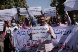 Sudanese journalist protest in Khartoum, Sudan, Nov.16, 2021. The placard in the middle reads: "free press will remain, tyrants are fleeting."