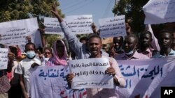 Sudanese journalists protest in Khartoum, Sudan, on November 16, 2021. The placard in the middle reads: "Free press will remain, tyrants are fleeting."