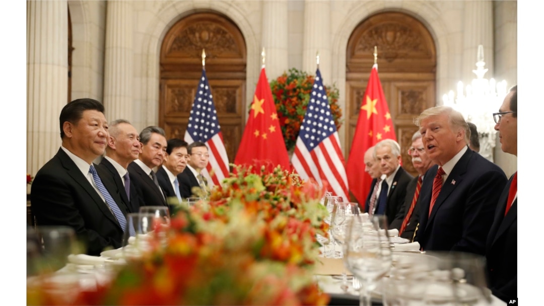 FILE - President Donald Trump speaks with China's President Xi Jinping during their bilateral meeting in Buenos Aires, Argentina, Dec. 1, 2018.