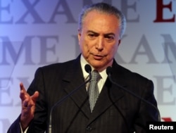 FILE - Brazil's President Michel Temer gestures as he attends an economics and politics forum in Sao Paulo, Brazil, Sept. 30, 2016.