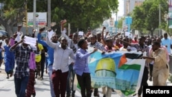 Somalis attend a protest against U.S. President Donald Trump's decision to recognize Jerusalem as the capital of Israel, in Mogadishu, Somalia, Dec. 8, 2017.