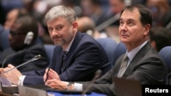 Members of the Russian delegation listen to proceedings at the International Civil Aviation Organization's (ICAO) global safety meeting in Montreal, Feb. 3, 2015. 