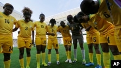 FILE: Zimbabwe's players confer prior to their group B match of the women's Olympic football tournament between against Canada in Sao Paulo, Brazil, Saturday, Aug. 6, 2016. (AP Photo/Nelson Antoine)