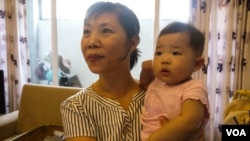  Tran Trinh is an educated and well-off woman, but she had hoped her daughter Minh would turn out to be a son. (VOA - L. Hoang)