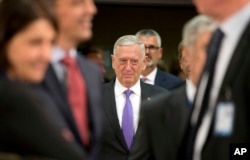 FILE - U.S. Secretary for Defense Jim Mattis arrives for a meeting of NATO defense ministers at NATO headquarters in Brussels, June 29, 2017.