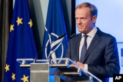 European Council President Donald Tusk addresses the media in Brussels, Belgium, July 10, 2018.