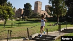 A woman jogs on the University of California Los Angeles (UCLA) campus in Los Angeles, California, U.S., on September 28, 2020. (REUTERS/Lucy Nicholson)