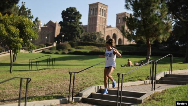 A woman jogs on the University of California Los Angeles (UCLA) campus in Los Angeles, California, U.S., on September 28, 2020. (REUTERS/Lucy Nicholson)