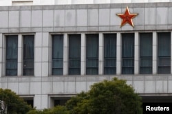FILE - Part of the building of 'Unit 61398,' a secretive Chinese military department, is seen on the outskirts of Shanghai.