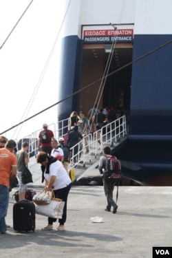 Most on this boat holding thousands of people are fleeing wars or extreme poverty related to war. But regular tourists were also aboard, Sept. 12, 2015. (Credit: Heather Murdock/VOA)