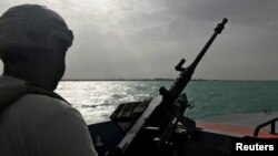 FILE - A UAE navy soldier patrols at Al-Mokha port in Yemen, March 6, 2018. 