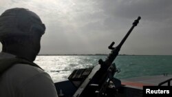 FILE - A UAE navy soldier patrols at Al-Mokha port in Yemen, March 6, 2018. 