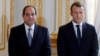 FILE - French President Emmanuel Macron and Egyptian President Abdel Fattah al-Sisi attend a news conference at the Elysee Palace, in Paris, Oct. 24, 2017. 