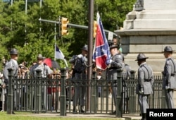 The Confederate battle flag is permanently removed from the South Carolina statehouse grounds during a ceremony in Columbia, South Carolina, July, 10, 2015.