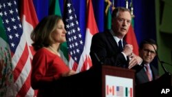 United States Trade Representative Robert Lighthizer, center, with Canadian Minister of Foreign Affairs Chrystia Freeland, left, and Mexico's Secretary of Economy Ildefonso Guajardo Villarrea, right, speaks during the conclusion of the fourth round of negotiations for a new North American Free Trade Agreement in Washington, Oct. 17, 2017. 