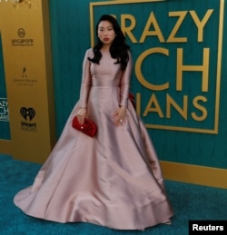 Cast member Awkwafina poses at the premiere for "Crazy Rich Asians" in Los Angeles, California, Aug. 7, 2018.
