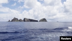 A group of disputed islands known as Senkaku in Japan and Diaoyu in China is seen from the city government of Tokyo's survey vessel in the East China Sea, September 2, 2012.
