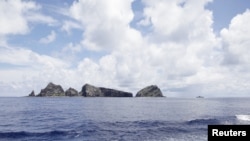 A group of disputed islands known as Senkaku in Japan and Diaoyu in China is seen from the city government of Tokyo's survey vessel in the East China Sea, September 2, 2012.