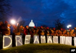 FILE - Demonstrators rally in support of Deferred Action for Childhood Arrivals (DACA) outside the Capitol, in Washington, Jan 21, 2018.