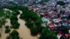 Esta toma aérea muestra inundaciones provocadas por intensas lluvias en la ciudad de Itapetinga, en el sur del estado de Bahía, el domingo 26 de diciembre de 2021, en Brasil.