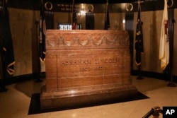 FILE - In this Tuesday, Nov. 19, 2013 file photo, a marker is seen over the burial site of Abraham Lincoln inside Lincoln’s tomb within Oak Ridge Cemetery in Springfield, Ill.