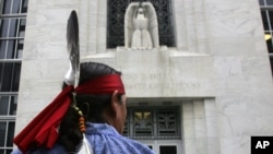 FILE - Jake Edwards, of the Onondaga Council of Chiefs, stands outside the federal courthouse in Albany, N.Y., Oct. 11, 2007, after arguments were heard in the Onondaga Indian Nation's land claim case against New York state. 