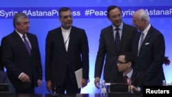 Russian lead negotiator on Syria Alexander Lavrentyev, Iranian Deputy Foreign Minister Hossein Jaberi Ansari, Kazakh Foreign Minister Kairat Abdrakhmanov and U.N. Special Envoy for Syria Staffan de Mistura attend the fourth round of Syria peace talks in A