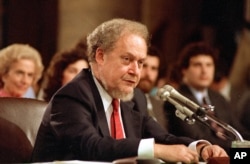 FILE - U.S. Supreme Court nominee Robert H. Bork testifies before the Senate Judiciary Committee during his confirmation hearings on Capitol Hill, September 16, 1987.