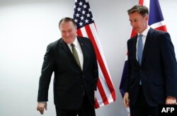 U.S. Secretary of State Mike Pompeo, left, poses with Britain's Foreign Secretary Jeremy Hunt at the European Council in Brussels, Belgium, May 13, 2019.