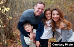 Bopha Malone, a former candidate for Congress in MA, pictured with her husband and children. (Courtesy photo of Bopha Malone)