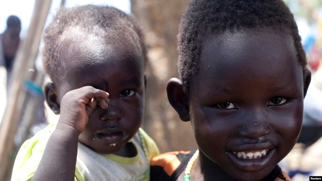 South Sudanese children displaced by fighting pose for a photo at a refugee camp in Jonglei, the country’s largest state, on April 29, 2014.