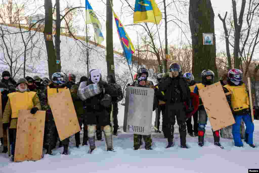 Members of various anti-government paramilitary groups attend a religious service at a chapel in Kyiv, Jan. 29, 2014.&nbsp;