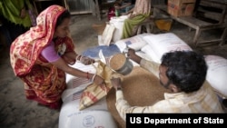 Targeted food distribution by USAID partner Save the Children in Barisal region of Bangladesh. Aid programs should be viewed as an investment, Kerry said.