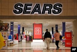 FILE - Shoppers walk into a Sears store in Pittsburgh, Pennsylvania, Feb. 8, 2017.