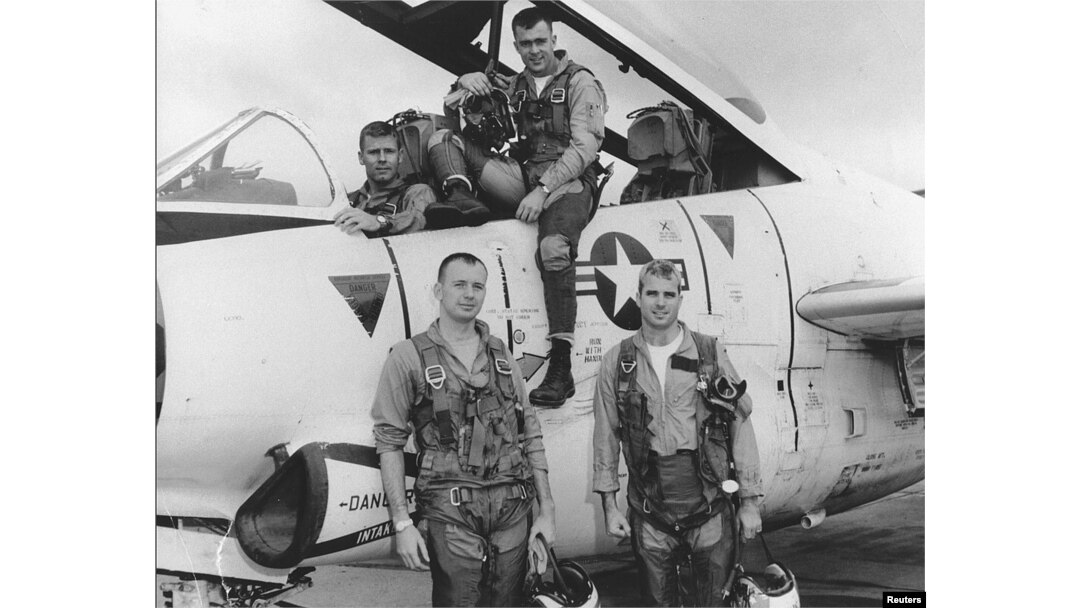 John McCain, bottom right, poses with his U.S. Navy squadron in 1965.