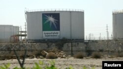 FILE - Oil tanks are seen at the Saudi Aramco headquarters in Damam city, Nov. 11, 2007. 