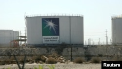 FILE - Oil tanks are seen at the Saudi Aramco headquarters in Damam city, Nov. 11, 2007. 