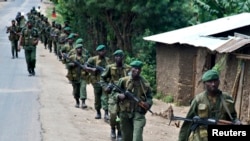 FILE - Congolese soldiers patrol the town of Rutshuru in eastern Congo, January 28, 2009. 