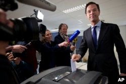 Dutch Prime Minister Mark Rutte casts his vote in a non-binding referendum on the EU-Ukraine association agreement in The Hague, Netherlands, April 6, 2016.