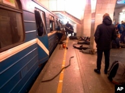 Blast victims lie near a subway train hit by a explosion at the Tekhnologichesky Institut subway station in St.Petersburg, Russia, April 3, 2017.