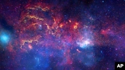 An unprecedented image of the central region of our Milky Way galaxy using infrared light and X-ray light to see through the obscuring dust and reveal the intense activity near the galactic core, FILE November 11, 2009.