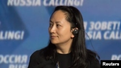 FILE - Meng Wanzhou, Executive Board Director of the Chinese technology giant Huawei, attends a session of the VTB Capital Investment Forum in Moscow, Oct. 2, 2014. 