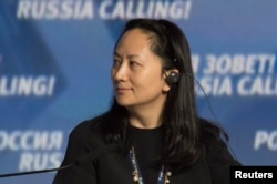 FILE - Huawei's Meng Wanzhou attends a session of the VTB Capital Investment Forum "Russia Calling!" in Moscow, Oct. 2, 2014.