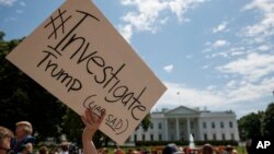 Demonstrators gather outside the White House in support of an investigation of Donald Trump, May 10, 2017.