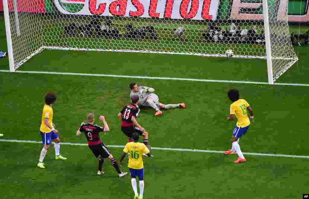 Germany's Andre Schuerrle scores his side's 6th goal during the World Cup semifinal soccer match between Brazil and Germany at the Mineirao Stadium in Belo Horizonte, Brazil, July 8, 2014. 