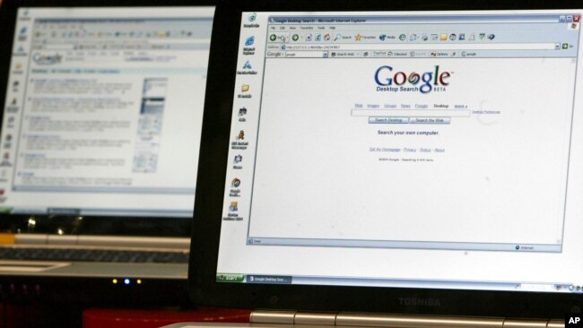 FILE - This Oct. 14, 2004, photo shows computers displaying the Google desktop search engine at the Digitallife show at New York's Jacob K. Javitz convention center.
